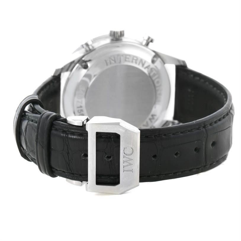 The image shows the back view of the IWC Portuguese IW371447 Men's Stainless Steel Black Dial IW371447 Men's Stainless Steel Black Dial model watch, including its case back and black leather strap with an engraved buckle.