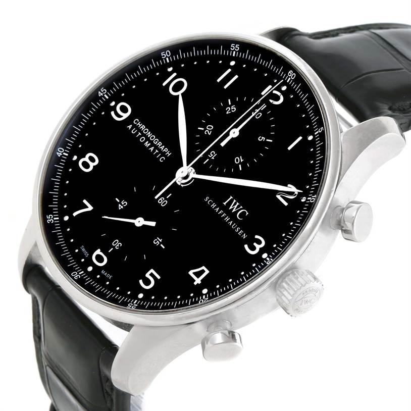 This image shows an oblique angle of the IWC Portuguese IW371447 Men's Stainless Steel Black Dial IW371447 Men's Stainless Steel Black Dial Automatic Chronograph, highlighting the dial, crown, pushers, and black leather strap.