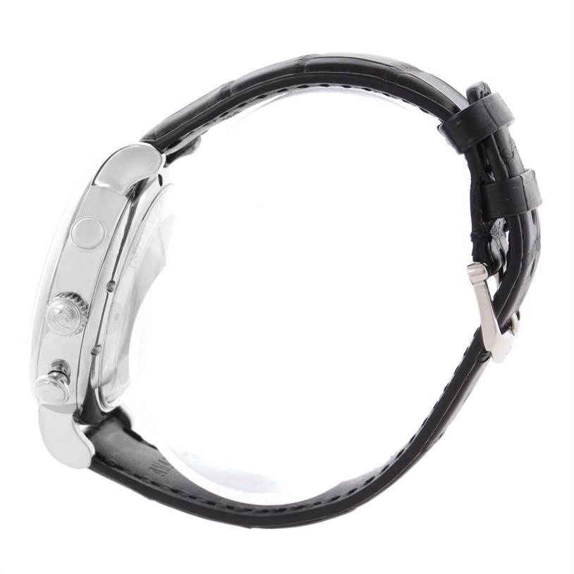 This side view of the IWC Portofino IW371447 Men's Stainless Steel Black Dial IW371447 Men's Stainless Steel Black Dial watch shows its crown, push-buttons, case, and black leather strap with a metal clasp.