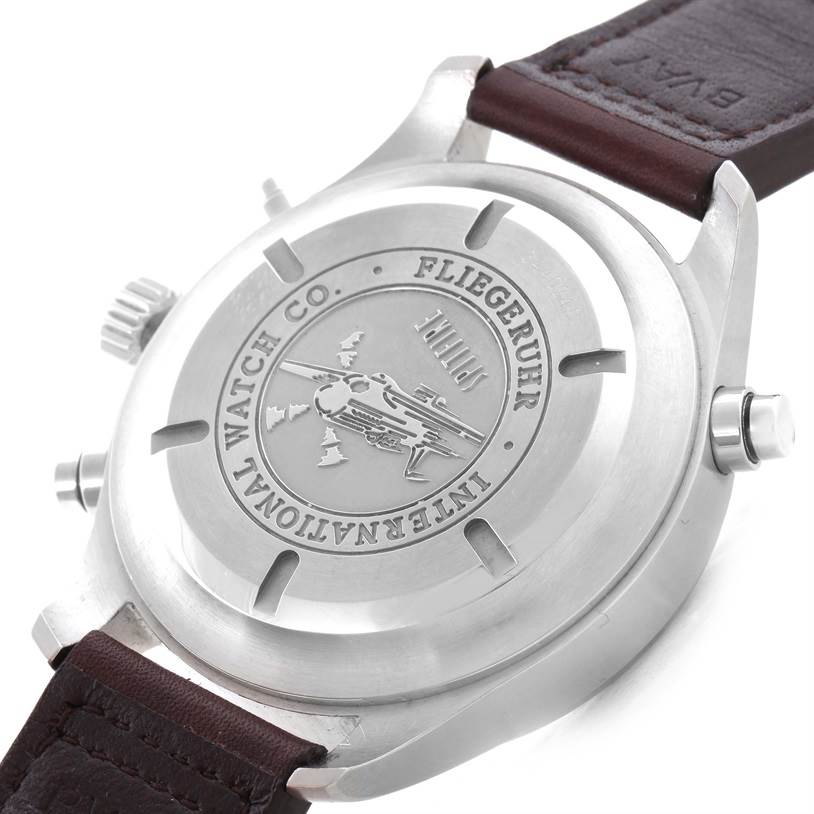 The image shows the back case and leather strap of an IWC Pilot IW371806 Men's Stainless Steel Silver Dial IW371806 Men's Stainless Steel Silver Dial model watch, featuring engravings and a polished finish.