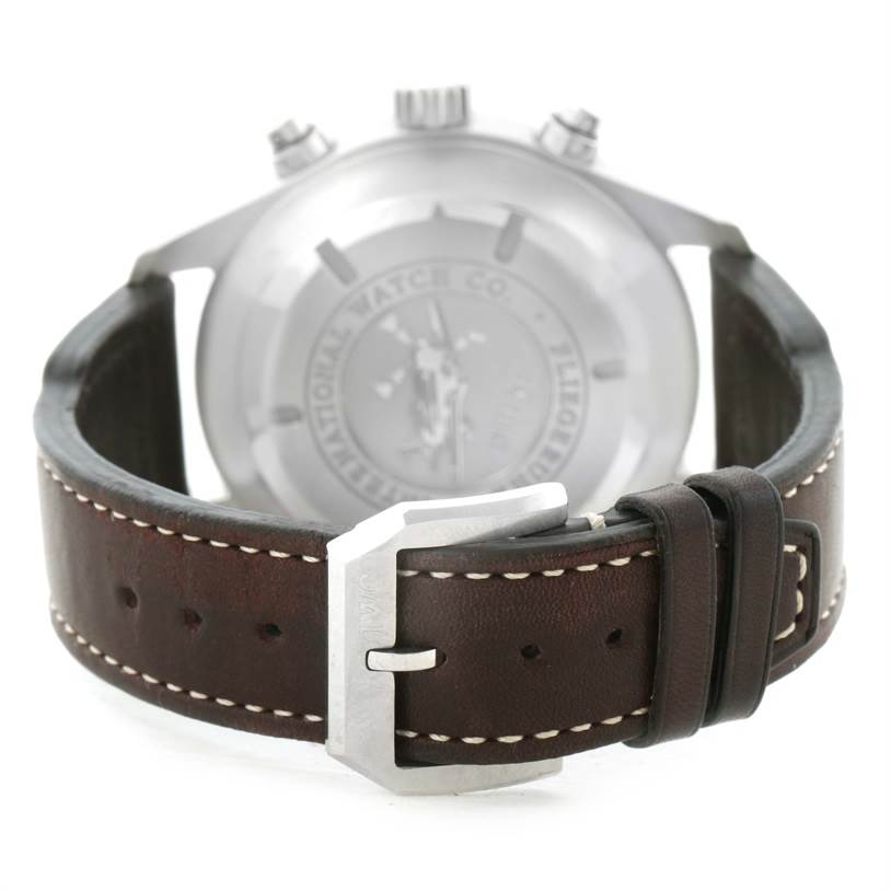 The image shows the back view of an IWC Pilot IW371806 Men's Stainless Steel Silver Dial IW371806 Men's Stainless Steel Silver Dial watch, focusing on its leather strap and buckle.