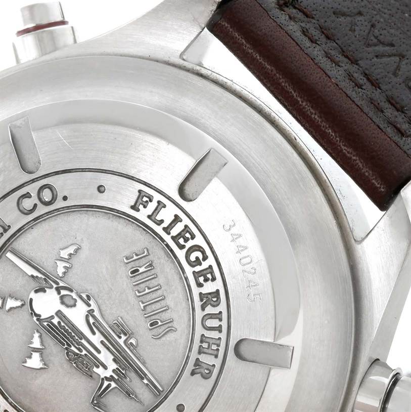 The image shows the back of an IWC Pilot IW371806 Men's Stainless Steel Silver Dial IW371806 Men's Stainless Steel Silver Dial model watch, highlighting the case back engraving and part of the leather strap.