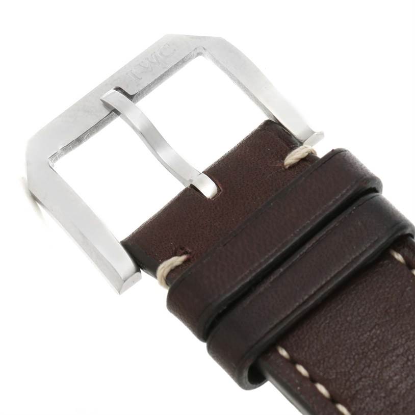 The image shows a close-up view of the buckle and strap of the Pilot model watch by IWC.
