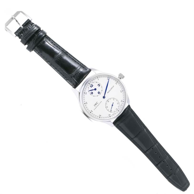 This image shows an IWC Portuguese IW544401 Men's Stainless Steel Silver Dial IW544401 Men's Stainless Steel Silver Dial model watch from a top-down angle with a black leather strap and silver round case.