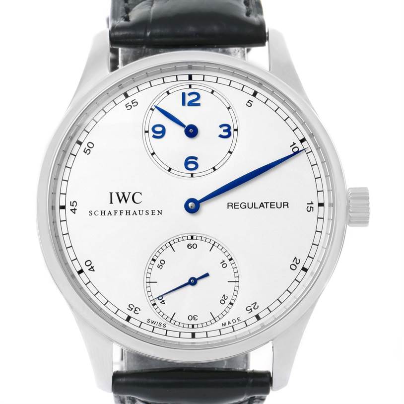 This image shows a front view of an IWC Portuguese IW544401 Men's Stainless Steel Silver Dial IW544401 Men's Stainless Steel Silver Dial Regulateur watch, highlighting its white dial, blue hands, and black leather strap.