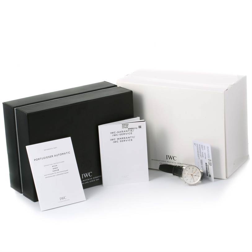 The image shows the IWC Portuguese IW371445 Men's Stainless Steel Silver Dial IW371445 Men's Stainless Steel Silver Dial Automatic watch, along with its black and white boxes, warranty card, and instruction manuals.