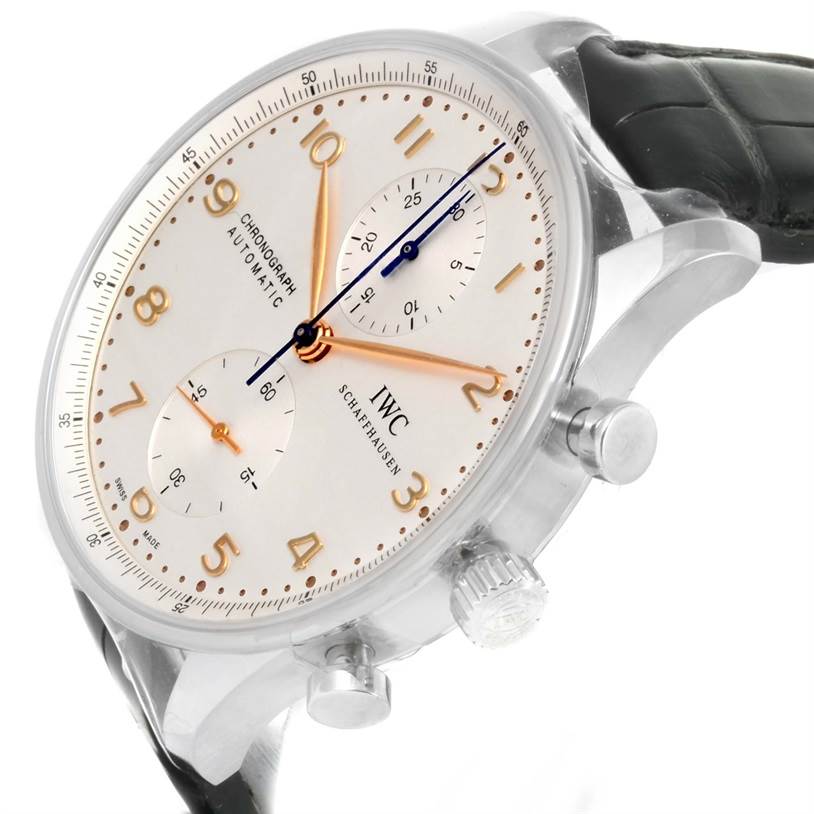 The image shows a side angle of an IWC Portuguese IW371445 Men's Stainless Steel Silver Dial IW371445 Men's Stainless Steel Silver Dial model watch, highlighting its dial, crown, and strap.