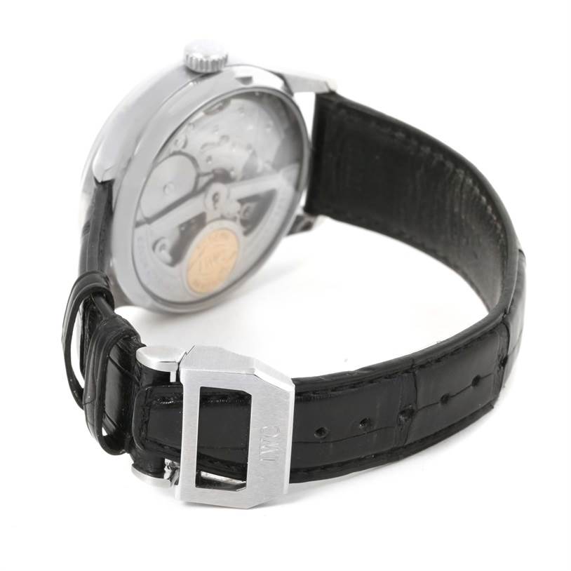 The image shows the back view of an IWC Portuguese IW500109 Men's Stainless Steel Black Dial IW500109 Men's Stainless Steel Black Dial watch, highlighting the movement and the leather strap with the IWC buckle.