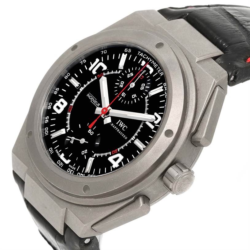 The image shows an IWC Ingenieur IW372504 Men
s Titanium Black Dial IW372504 Men
s Titanium Black Dial watch at a slight angle, highlighting its face, bezel, crown, and leather strap.