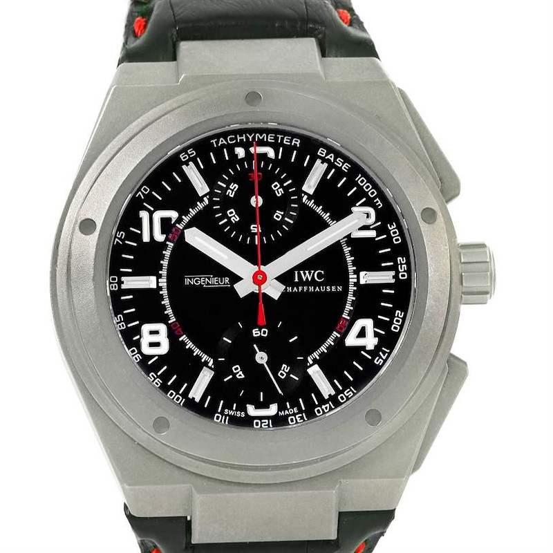 The IWC Ingenieur watch is shown from a front angle, displaying the face, bezel, and part of the strap.