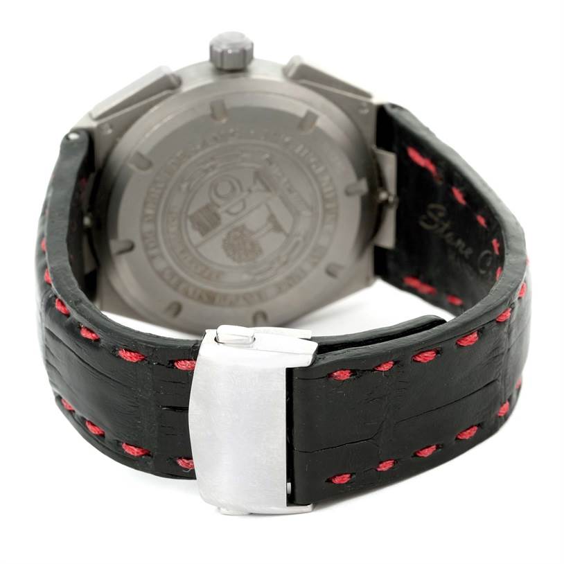 The image shows the back case and clasp of the IWC Ingenieur IW372504 Men
s Titanium Black Dial IW372504 Men
s Titanium Black Dial watch, focusing on the leather strap and engraved back.