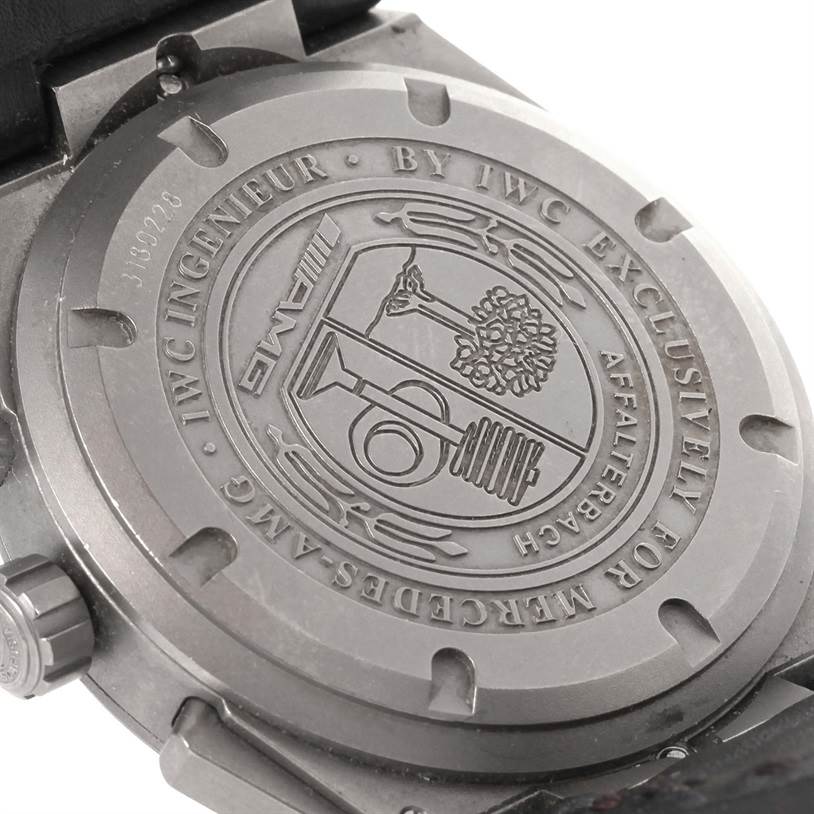 The image shows the engraved case back of the IWC Ingenieur IW372504 Men
s Titanium Black Dial IW372504 Men
s Titanium Black Dial watch, highlighting its detailed design and branding.