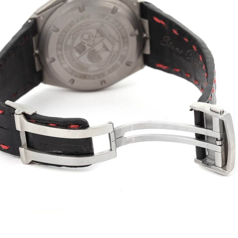 The image shows the backside of an IWC Ingenieur IW372504 Men
s Titanium Black Dial IW372504 Men
s Titanium Black Dial watch featuring its case back and deployant buckle with leather straps.