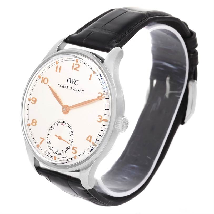 The image shows an oblique view of an IWC Portuguese IW545405 Men's Stainless Steel Silver Dial IW545405 Men's Stainless Steel Silver Dial watch, highlighting its dial, hands, crown, and strap.
