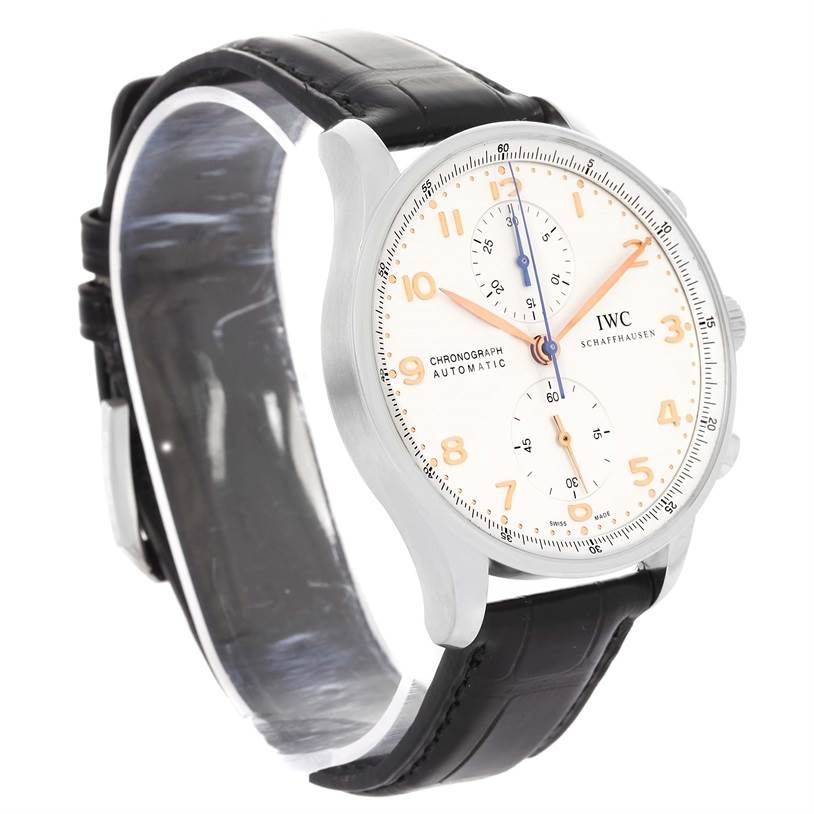 The IWC Portuguese IW371401 Men's Stainless Steel Silver Dial IW371401 Men's Stainless Steel Silver Dial watch is shown at an angled side view, highlighting its face, bezel, and black leather strap.