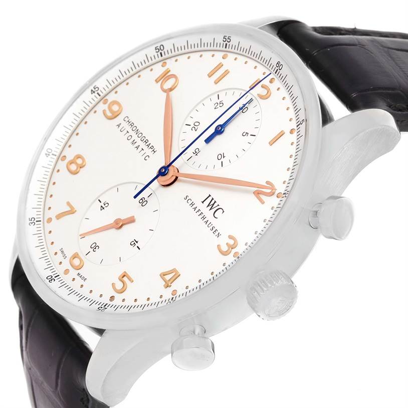 The image shows an angled view of the IWC Portuguese IW371401 Men's Stainless Steel Silver Dial IW371401 Men's Stainless Steel Silver Dial model watch face, crown, pushers, and part of the leather strap.