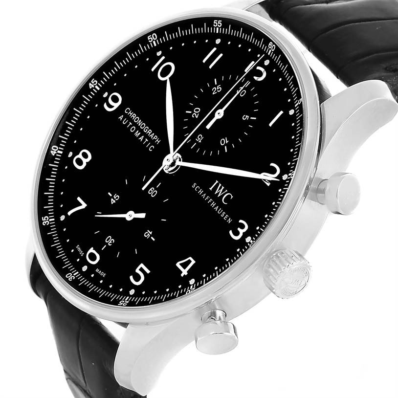 The image shows an angled view of the IWC Portuguese IW371447 Men's Stainless Steel Black Dial IW371447 Men's Stainless Steel Black Dial model watch, highlighting its black dial, crown, and pushers.