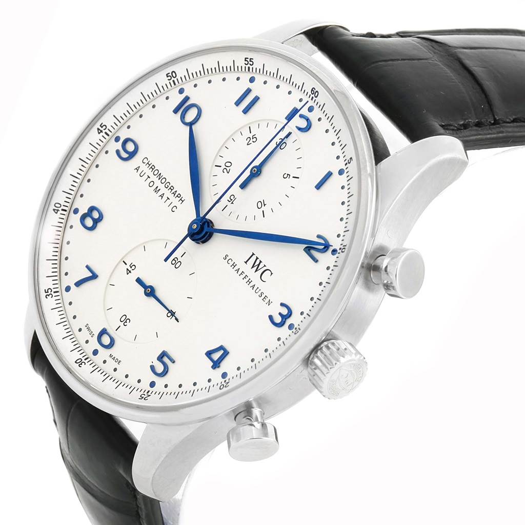 The IWC Portuguese IW371417 Men's Stainless Steel Silver Dial IW371417 Men's Stainless Steel Silver Dial watch is shown at a tilted angle, highlighting the dial, crown, pushers, and leather strap.