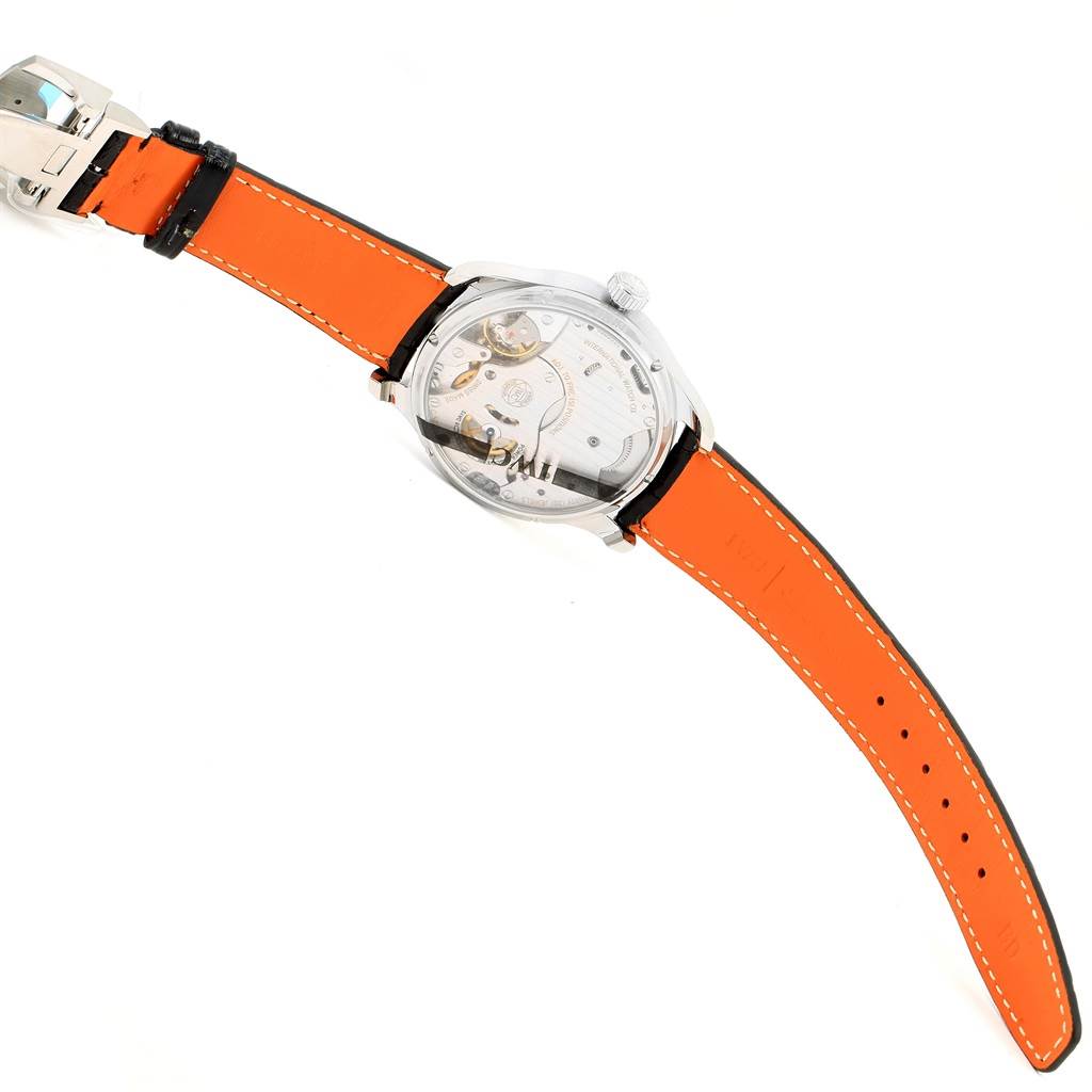 The image shows the back view of an IWC Portuguese IW510202 Men's Stainless Steel Black Dial IW510202 Men's Stainless Steel Black Dial model watch, highlighting its transparent case back and orange strap.