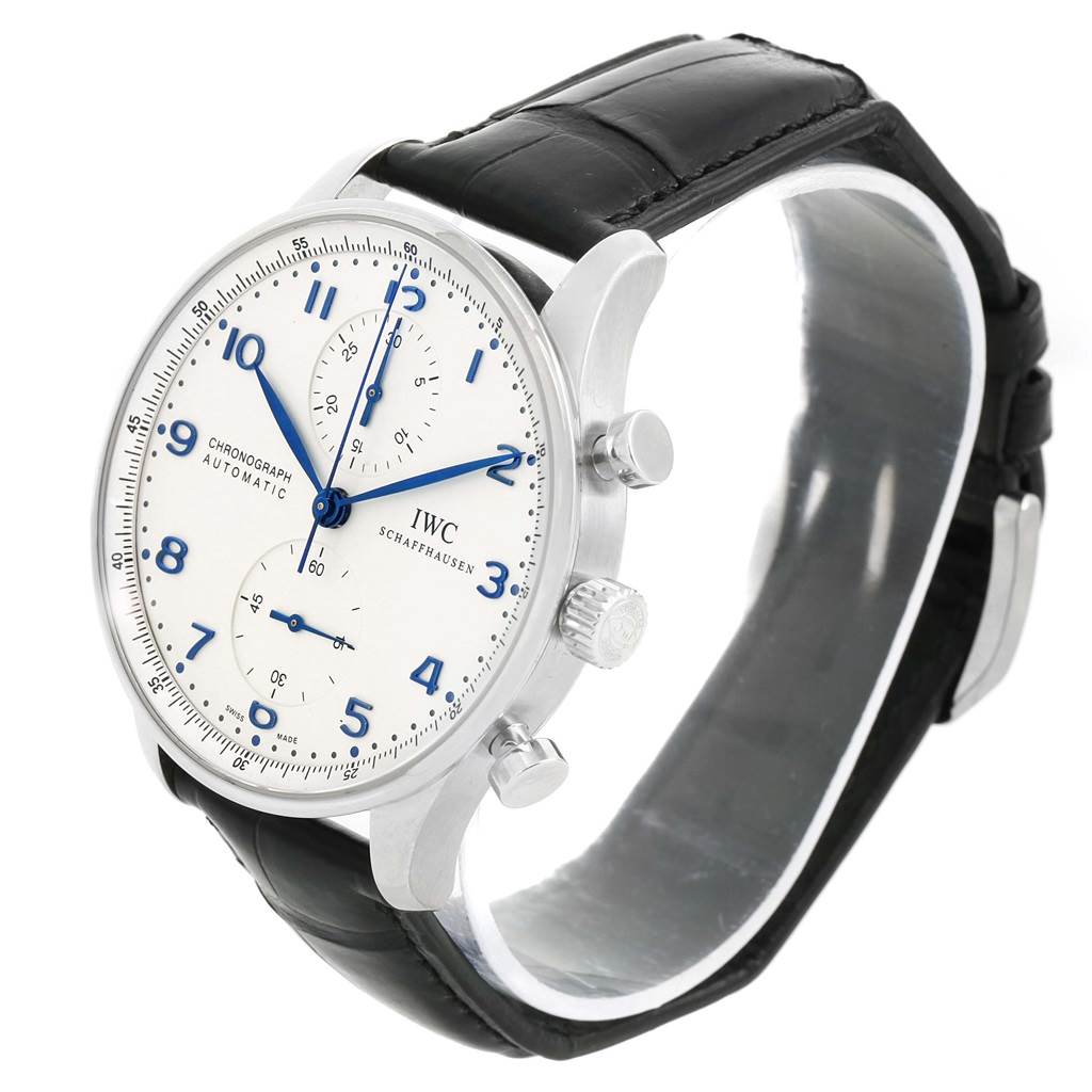 The IWC Portuguese IW371417 Men's Stainless Steel Silver Dial IW371417 Men's Stainless Steel Silver Dial watch is shown from a three-quarter angle, displaying its face, two pushers, crown, and black leather strap.