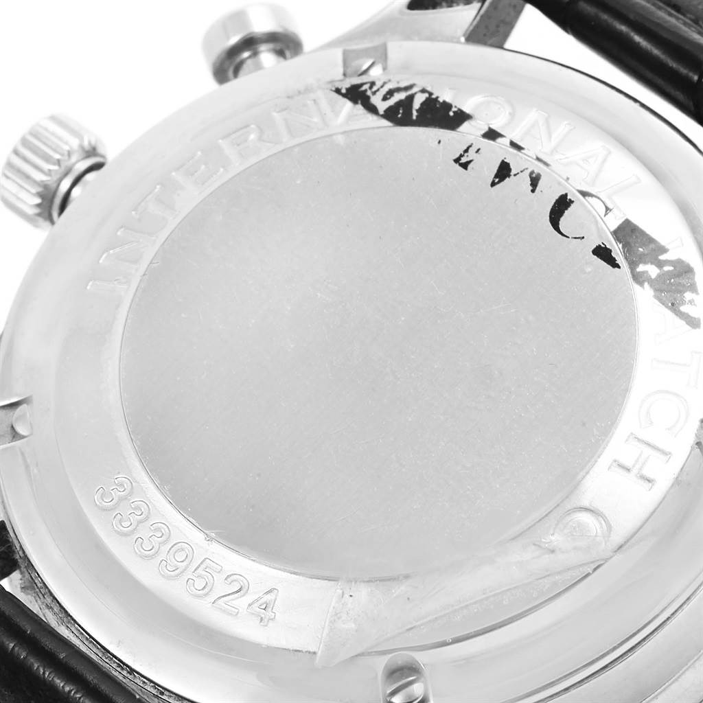 The image shows the back case of an IWC Portuguese IW371417 Men's Stainless Steel Silver Dial IW371417 Men's Stainless Steel Silver Dial model watch, including the crown, pushers, and partial engraving details.