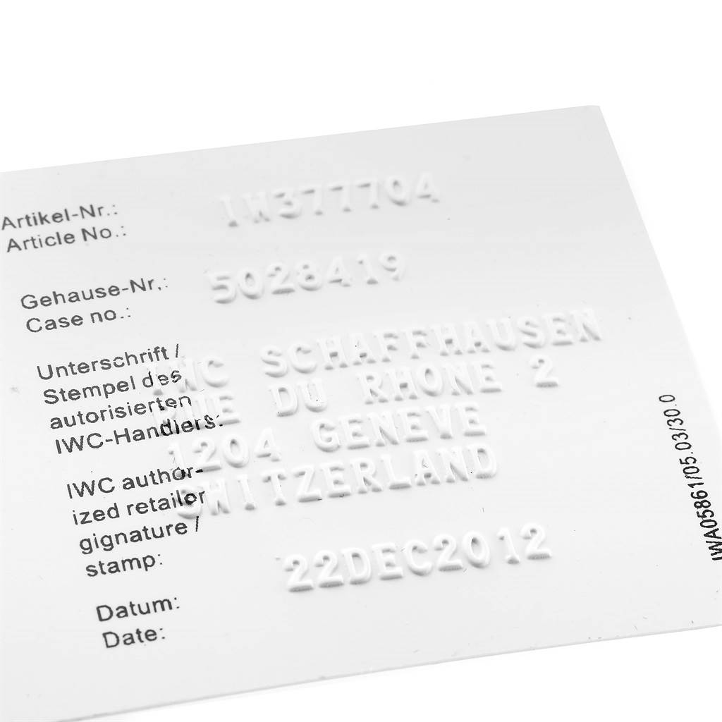 The image shows a warranty card for an IWC Pilot IW377704 Men's Stainless Steel Black Dial IW377704 Men's Stainless Steel Black Dial model watch, displaying article number, case number, and dealer information.