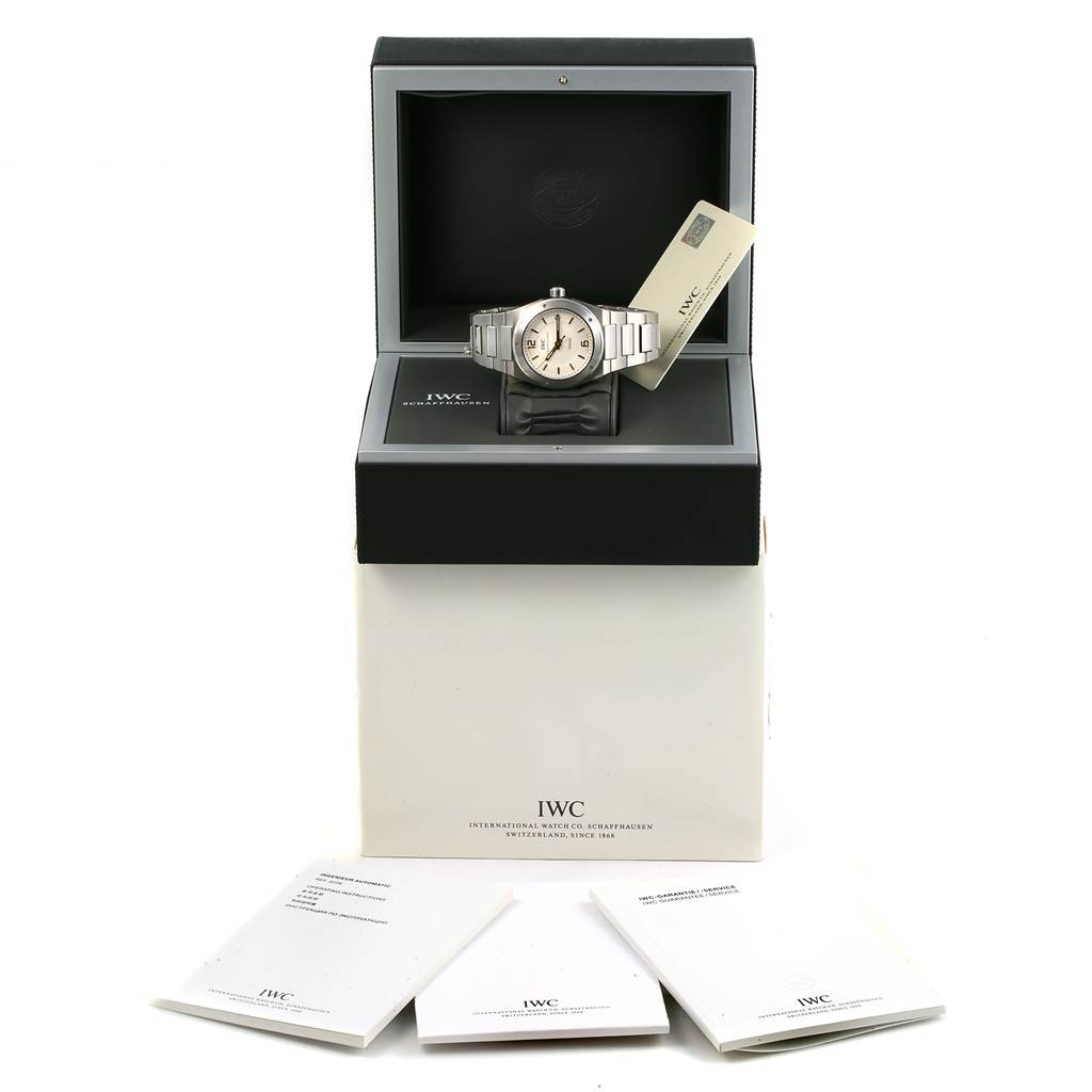 The IWC Ingenieur IW322801 Men's Stainless Steel Silver Dial IW322801 Men's Stainless Steel Silver Dial watch is displayed in an open box, with manuals and accessories shown in front.
