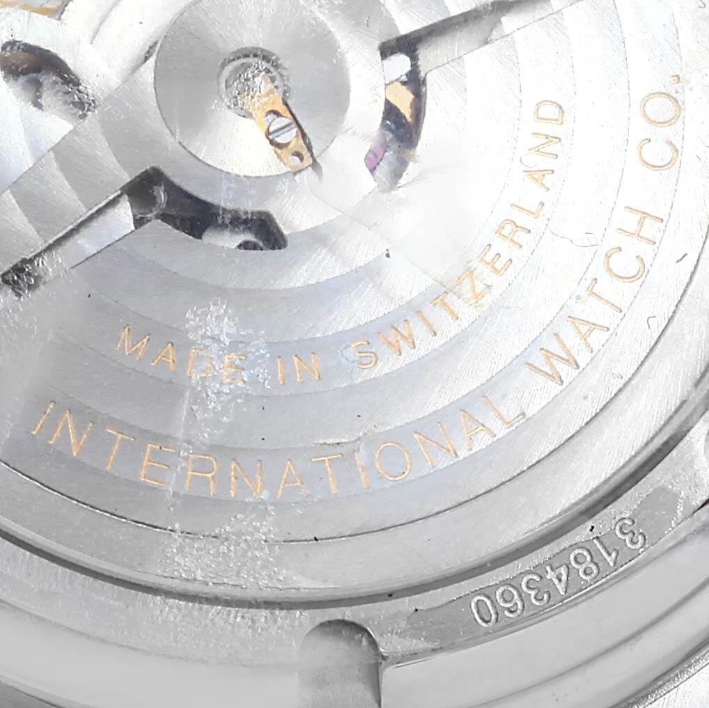The image shows the back of an IWC Ingenieur IW322801 Men's Stainless Steel Silver Dial IW322801 Men's Stainless Steel Silver Dial watch, specifically the internal mechanism with "Made in Switzerland" and "International Watch Co." engraved.