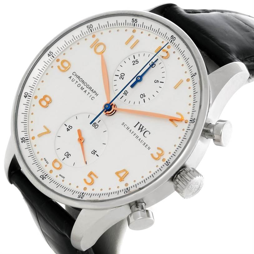 The IWC Portuguese IW371445 Men's Stainless Steel Silver Dial IW371445 Men's Stainless Steel Silver Dial watch is shown at an oblique angle, highlighting its dial, crown, pushers, and part of the black leather strap.