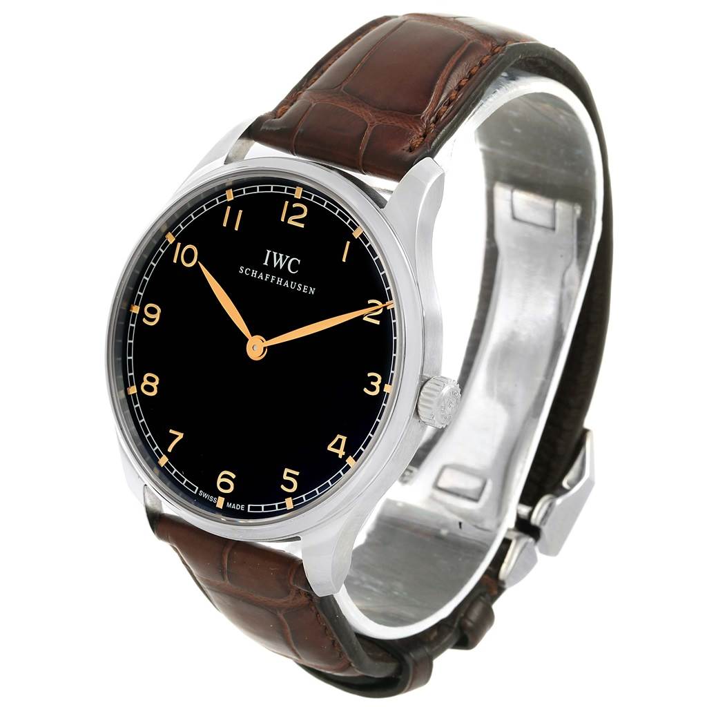 The image shows a front angle view of an IWC Ingenieur IW570302 Men's Stainless Steel Black Dial IW570302 Men's Stainless Steel Black Dial watch, highlighting its black dial, orange hands, and brown leather strap.