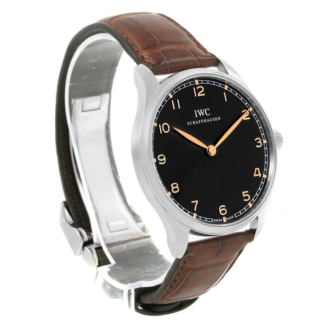 The image shows the IWC Ingenieur IW570302 Men's Stainless Steel Black Dial IW570302 Men's Stainless Steel Black Dial watch from a front-side angle, highlighting its black dial, gold numerals, and brown leather strap.