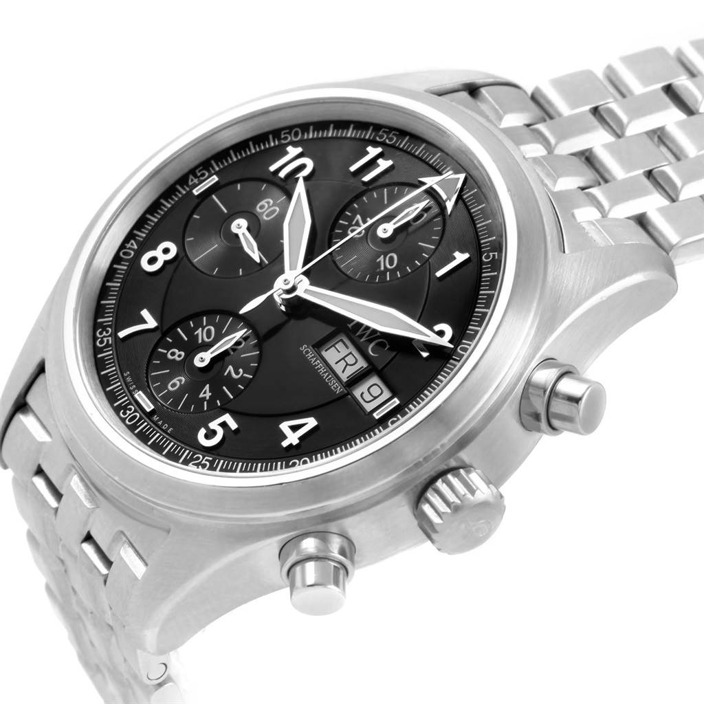 The image shows an angled view of the IWC Pilot IW370618 Men's Stainless Steel Black Dial IW370618 Men's Stainless Steel Black Dial watch, highlighting the dial, crown, pushers, and metal bracelet.