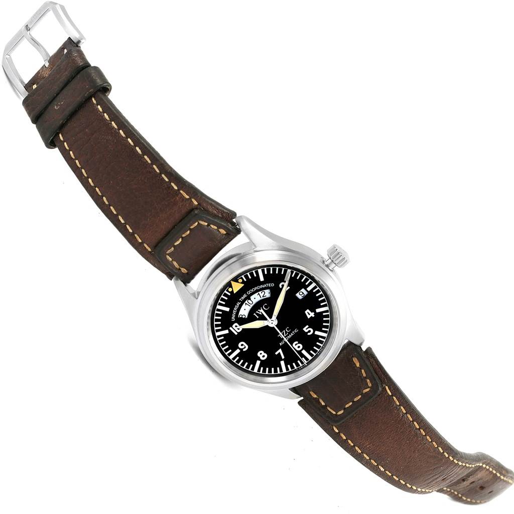 The image shows a top view of an IWC Pilot IW325102 Men's Stainless Steel Black Dial IW325102 Men's Stainless Steel Black Dial model watch with a brown leather strap and black dial.