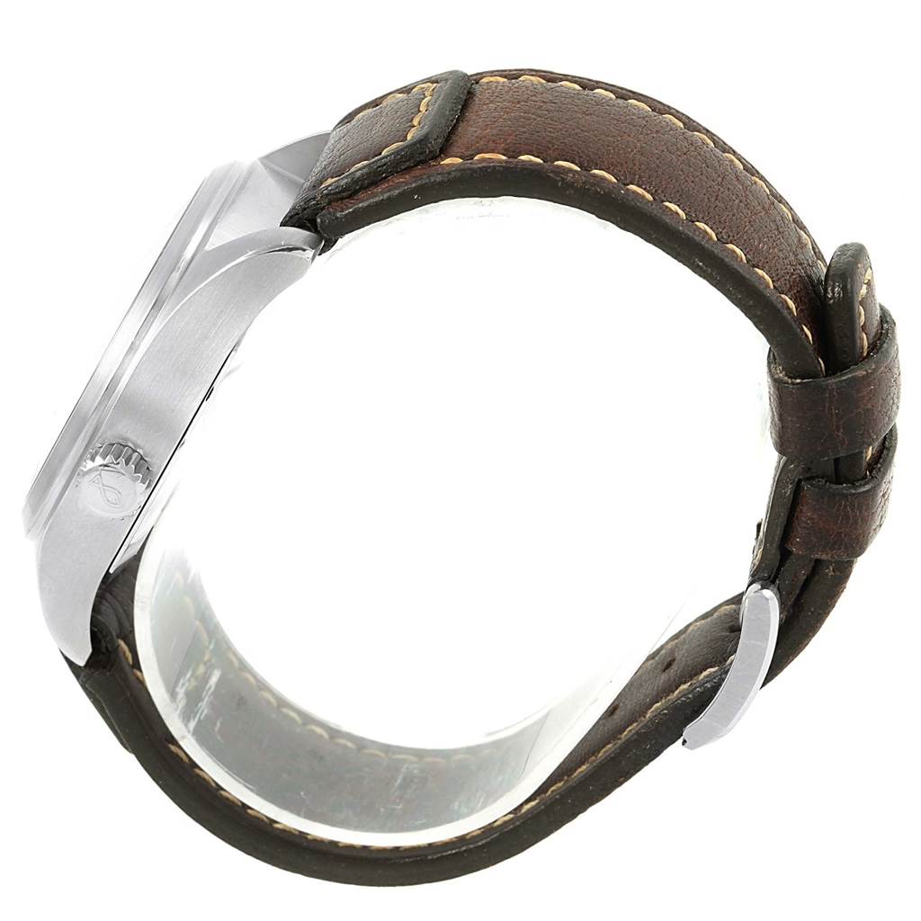 The IWC Pilot IW325102 Men's Stainless Steel Black Dial IW325102 Men's Stainless Steel Black Dial model watch is shown from a side angle, displaying its case, crown, and leather strap.