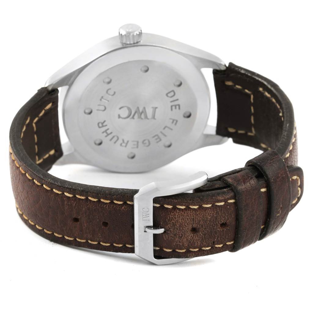 The image shows the back casing and buckle of the IWC Pilot IW325102 Men's Stainless Steel Black Dial IW325102 Men's Stainless Steel Black Dial model watch, highlighting the leather strap and engraved logo.