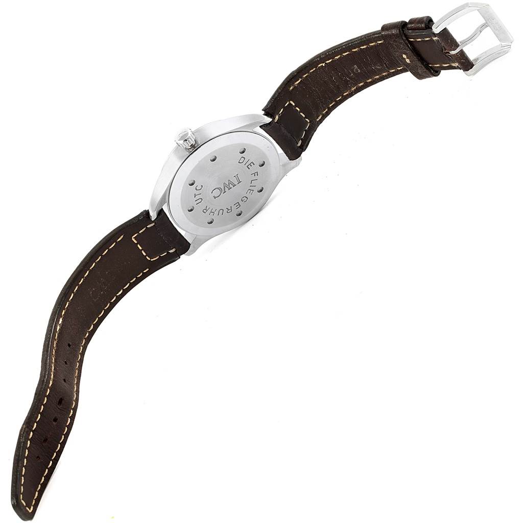 The image shows the back and strap of the IWC Pilot IW325102 Men's Stainless Steel Black Dial IW325102 Men's Stainless Steel Black Dial model watch, highlighting the case back and brown leather strap with buckle.