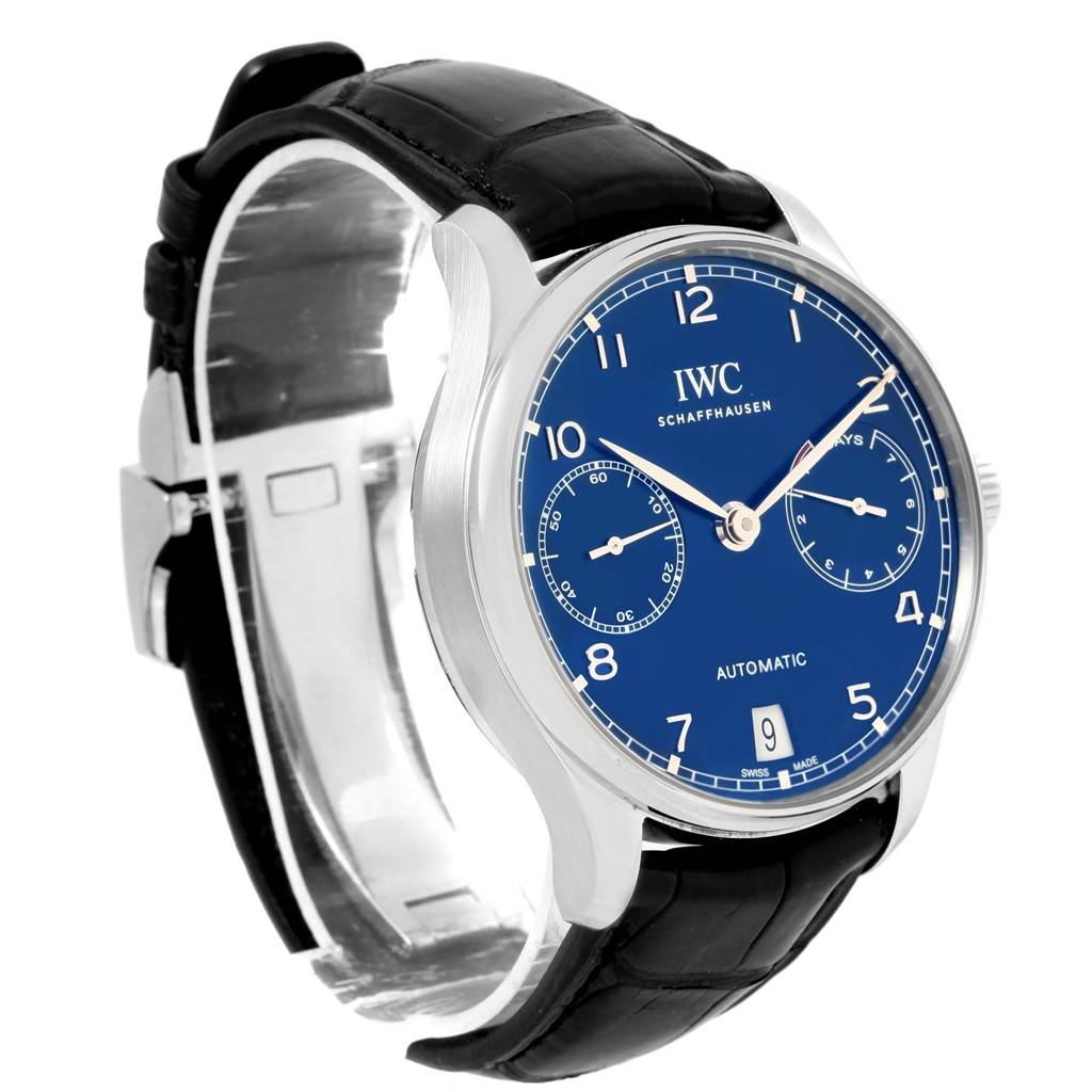 The image shows an angled side view of the IWC Portuguese IW500710 Men's Stainless Steel Blue Dial IW500710 Men's Stainless Steel Blue Dial model, highlighting the dial, leather strap, and clasp.