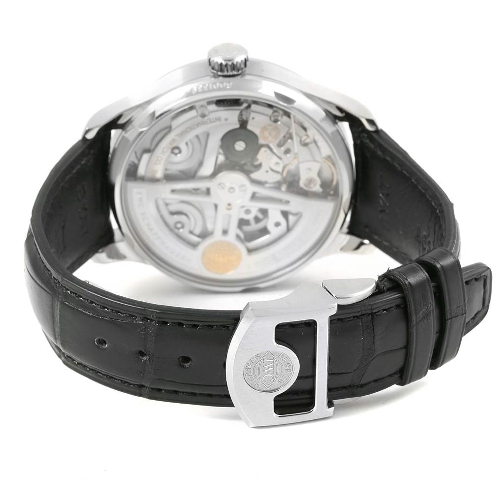 The image shows the back view of an IWC Portuguese IW500710 Men's Stainless Steel Blue Dial IW500710 Men's Stainless Steel Blue Dial model watch, featuring its clasp and visible mechanical movement.