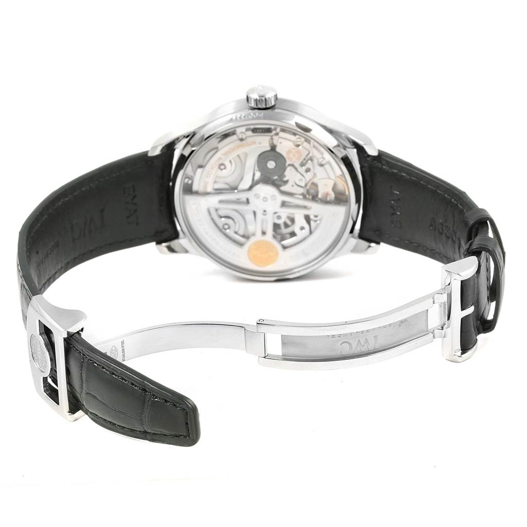 The image shows the back view of the IWC Portuguese IW500710 Men's Stainless Steel Blue Dial IW500710 Men's Stainless Steel Blue Dial model watch, highlighting its open caseback and black leather strap with a deployant clasp.