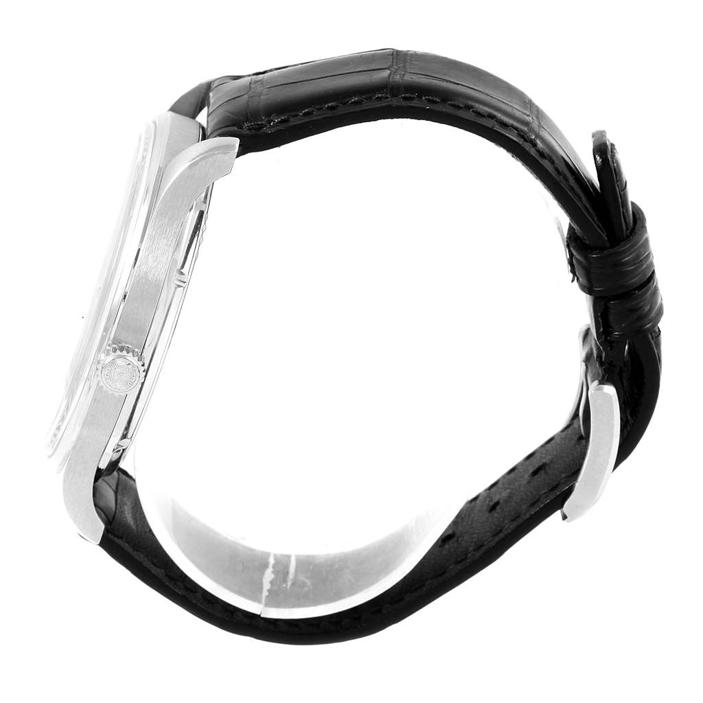 This image shows a side view of the IWC Portuguese IW545407 Men's Stainless Steel Black Dial IW545407 Men's Stainless Steel Black Dial watch displaying the case, crown, and black leather strap from the side.