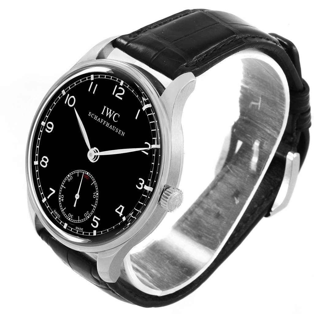 The image shows an IWC Portuguese IW545407 Men's Stainless Steel Black Dial IW545407 Men's Stainless Steel Black Dial watch at an oblique angle featuring its black dial, stainless steel case, and black leather strap.