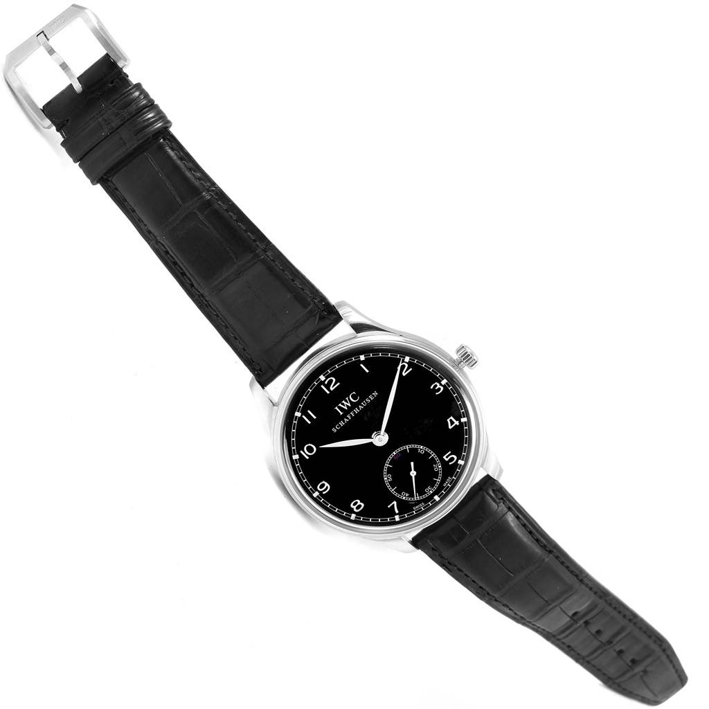 This is an overhead view of an IWC Portuguese IW545407 Men's Stainless Steel Black Dial IW545407 Men's Stainless Steel Black Dial model watch, displaying the dial, hour markers, and leather strap.