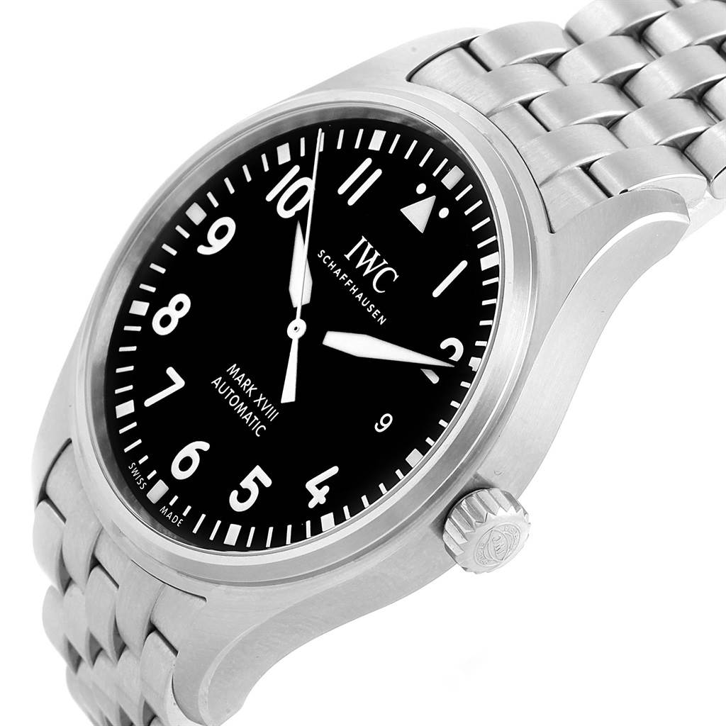 The image shows an angled view of the IWC Pilot IW327011 Men's Stainless Steel Black Dial IW327011 Men's Stainless Steel Black Dial Mark XVIII watch, highlighting the face, bezel, crown, and part of the bracelet.