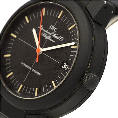 The image shows a close-up angle of the IWC Vintage Men's Stainless Steel Black Dial Men's Stainless Steel Black Dial Porsche Design watch, focusing on the dial, crown, and part of the strap.