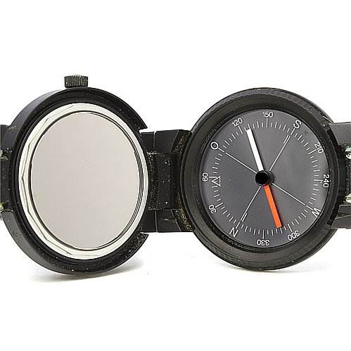 The image shows a vintage IWC watch with its cover open, revealing the dial and a compass feature.