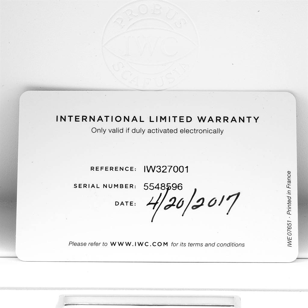 The image shows the International Limited Warranty card for the IWC Pilot IW327011 Men's Stainless Steel Black Dial IW327011 Men's Stainless Steel Black Dial model watch, including reference and serial numbers, and the purchase date.