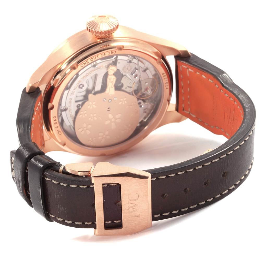 The image shows the back view of an IWC Pilot IW502701 Men's Rose Gold Blue Dial IW502701 Men's Rose Gold Blue Dial model watch, highlighting its open case back and black leather strap with a buckle.