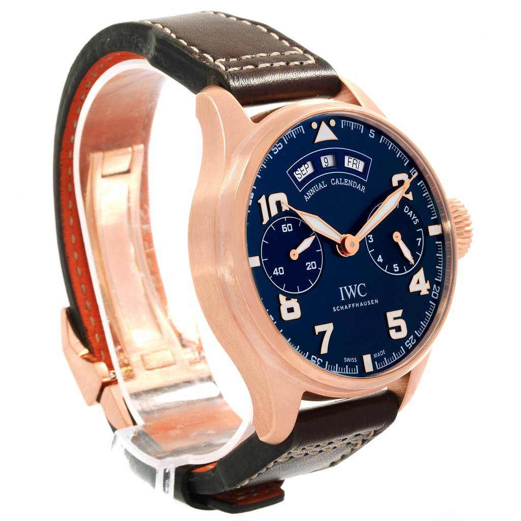 The image shows an angled view of the IWC Pilot IW502701 Men's Rose Gold Blue Dial IW502701 Men's Rose Gold Blue Dial model watch, highlighting the face, case, and leather strap.