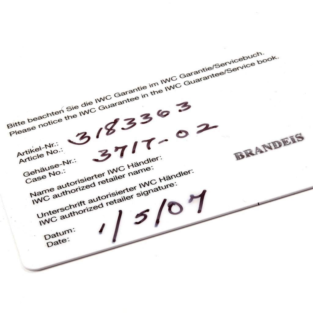 The image shows a warranty card for the IWC Pilot IW371705 Men's Stainless Steel Silver Dial IW371705 Men's Stainless Steel Silver Dial model watch, displaying the article number, case number, retailer name, and date of purchase.