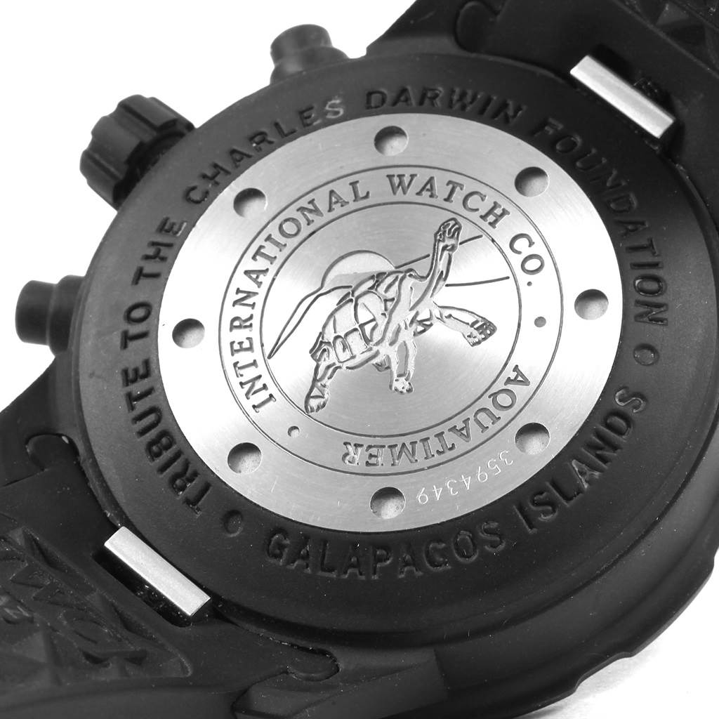 The image shows the backside of an IWC Aquatimer IWC376705 Men's Stainless Steel Black Dial IWC376705 Men's Stainless Steel Black Dial watch, featuring the case back with engraved text and design.